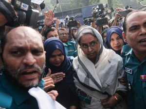 Citizens participating in a protest march in Dhaka
